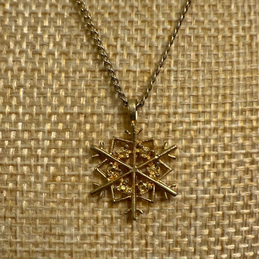 Gold Snowflake Pendant Necklace with floral clasp